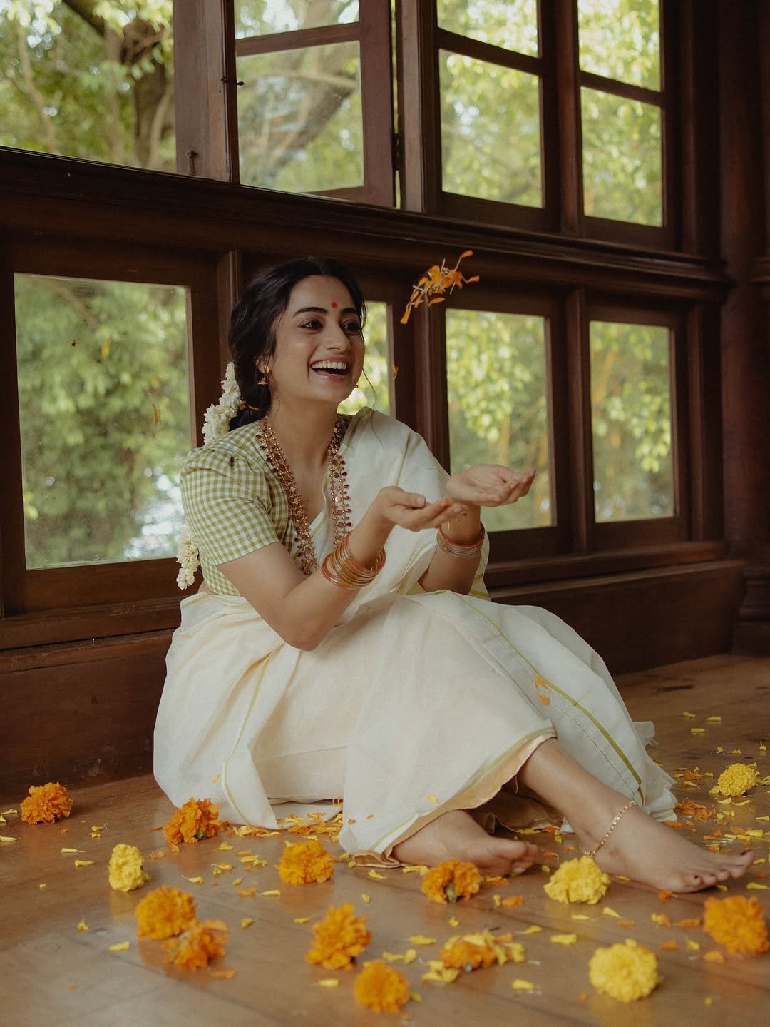 Namitha Pramod jasmine gajra white saree window-light smile Photoshoot (16)