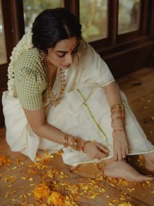 Soft window light creating glow on Namitha Pramod classic look