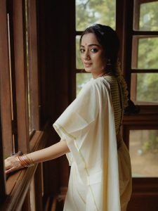Soft window light creating glow on Namitha Pramod classic look