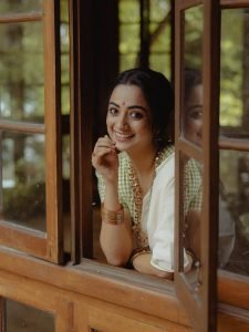 Soft window light creating glow on Namitha Pramod classic look