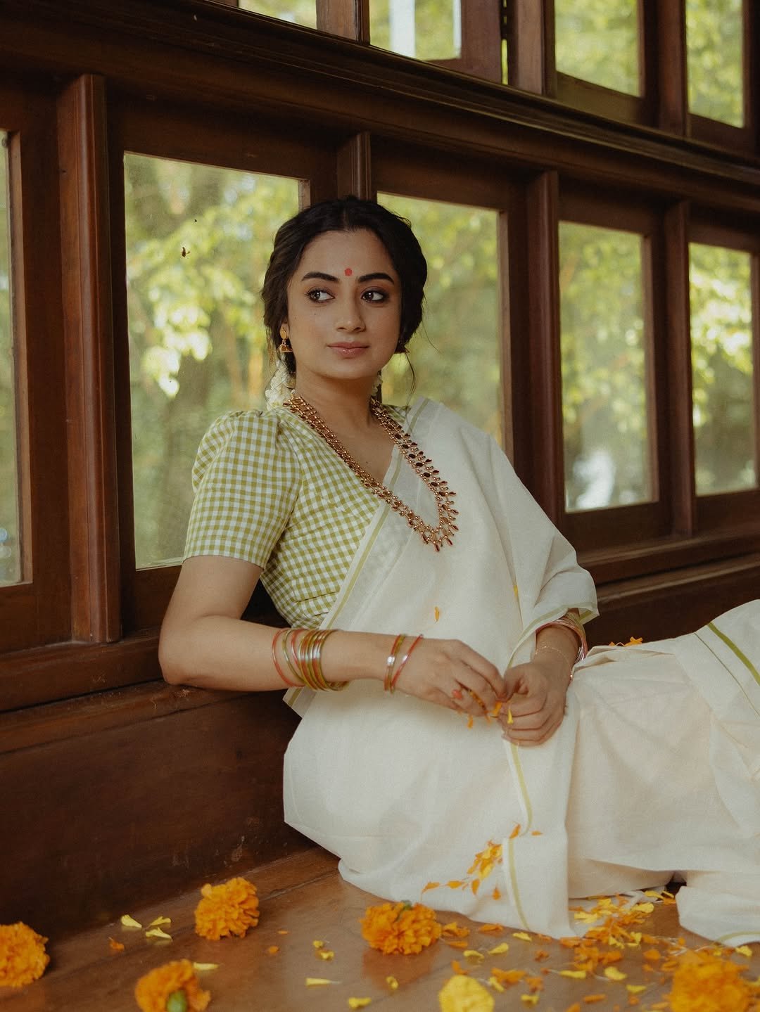 Namitha Pramod jasmine gajra white saree window-light smile Photoshoot (7)
