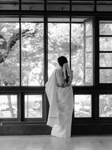 Namitha Pramod gentle smile in white saree with fresh gajra