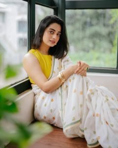 Namitha Pramod joyful expression in white saree colorful blouse combo