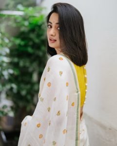 Namitha Pramod lemon yellow blouse with white printed saree in garden