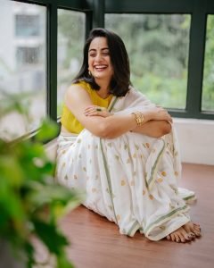 Namitha Pramod joyful expression in white saree colorful blouse combo