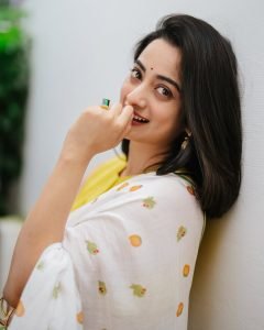 Namitha Pramod joyful expression in white saree colorful blouse combo
