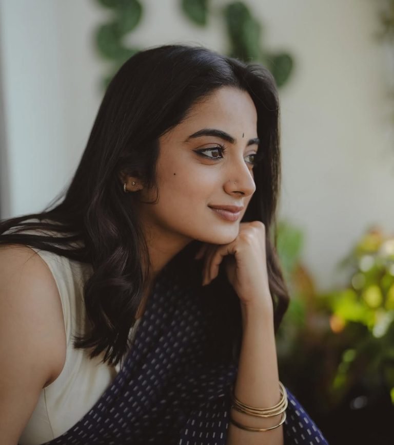 Namitha Pramod navy saree natural balcony lighting portrait