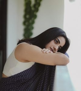 Elegant glow on Namitha Pramod in deep navy colored saree