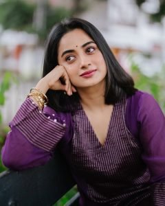 Namitha Pramod radiant smile in purple pleated salwar suit