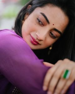 Namitha Pramod radiant smile in purple pleated salwar suit