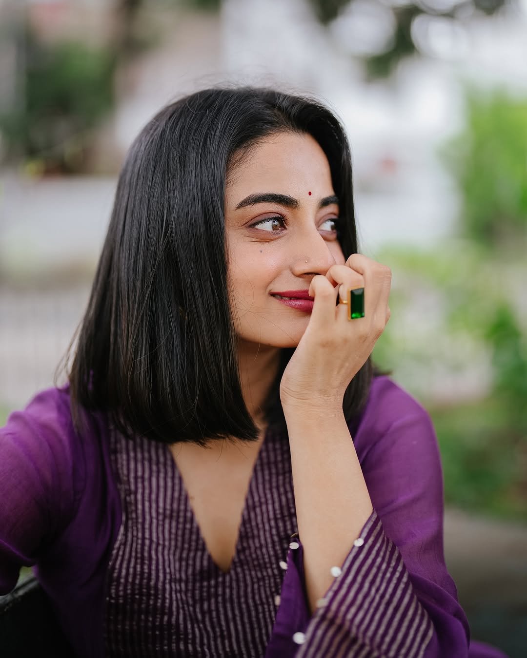 Namitha Pramod purple pleated suit garden bench radiant smile Photos (15)