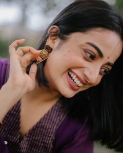 Purple pleated fabric detail in Namitha Pramod garden portrait
