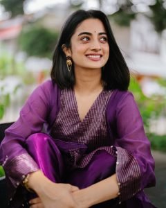 Namitha Pramod joyful expression wearing modern pleated suit
