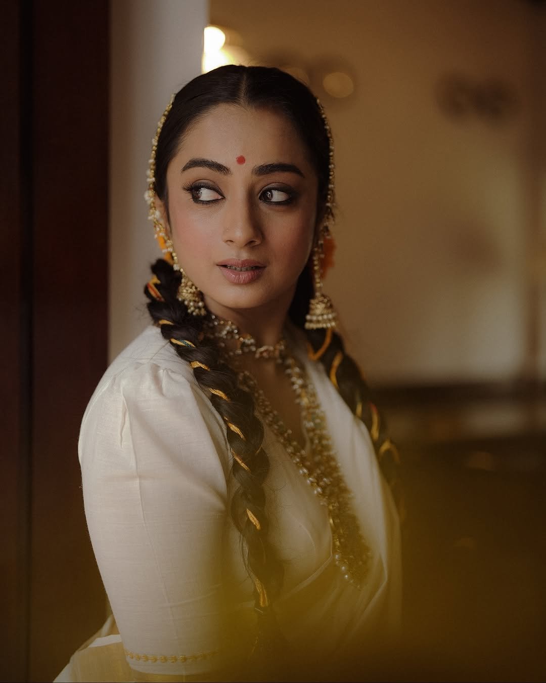 Namitha Pramod traditional braids jasmine gajra golden hour Photoshoot (18)