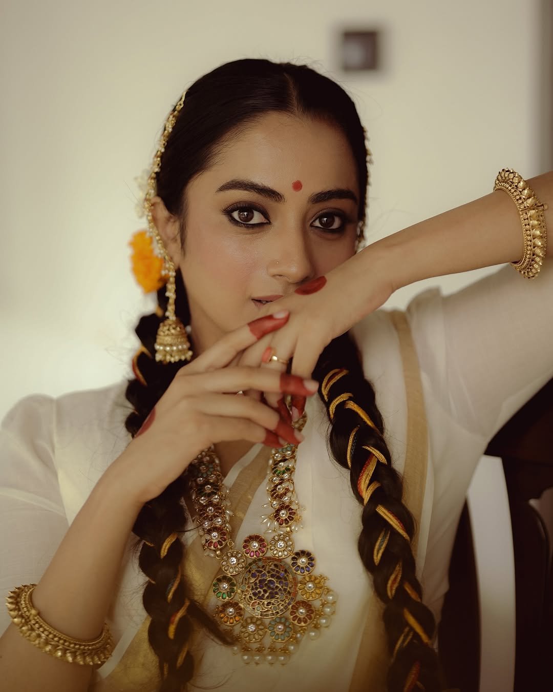 Namitha Pramod traditional braids jasmine gajra golden hour Photoshoot (19)