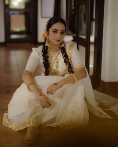 Close-up of jasmine flowers in Namitha Pramod traditional hair decoration