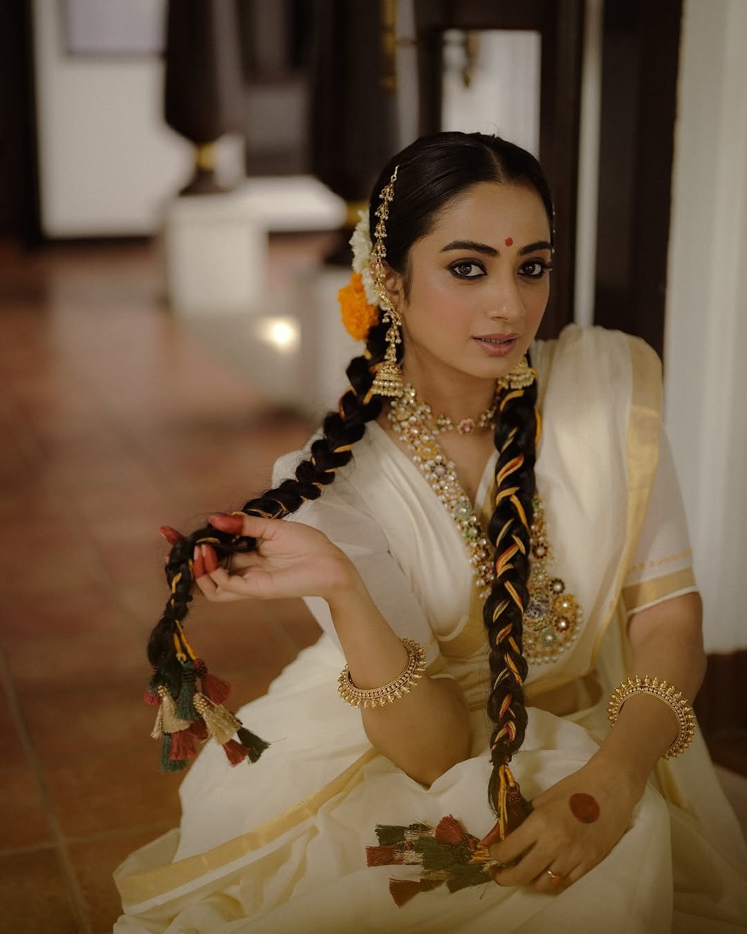 Close-up of jasmine flowers in Namitha Pramod traditional hair decoration