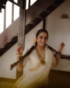 Namitha Pramod side profile showing traditional braid and gajra styling