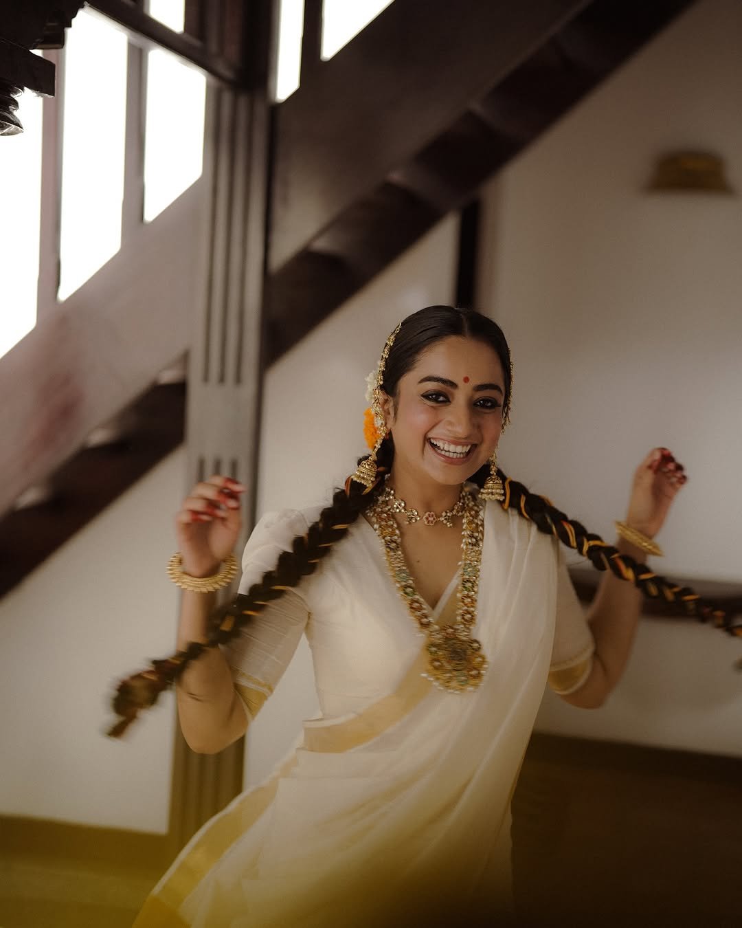 Namitha Pramod traditional braids jasmine gajra golden hour Photoshoot (7)