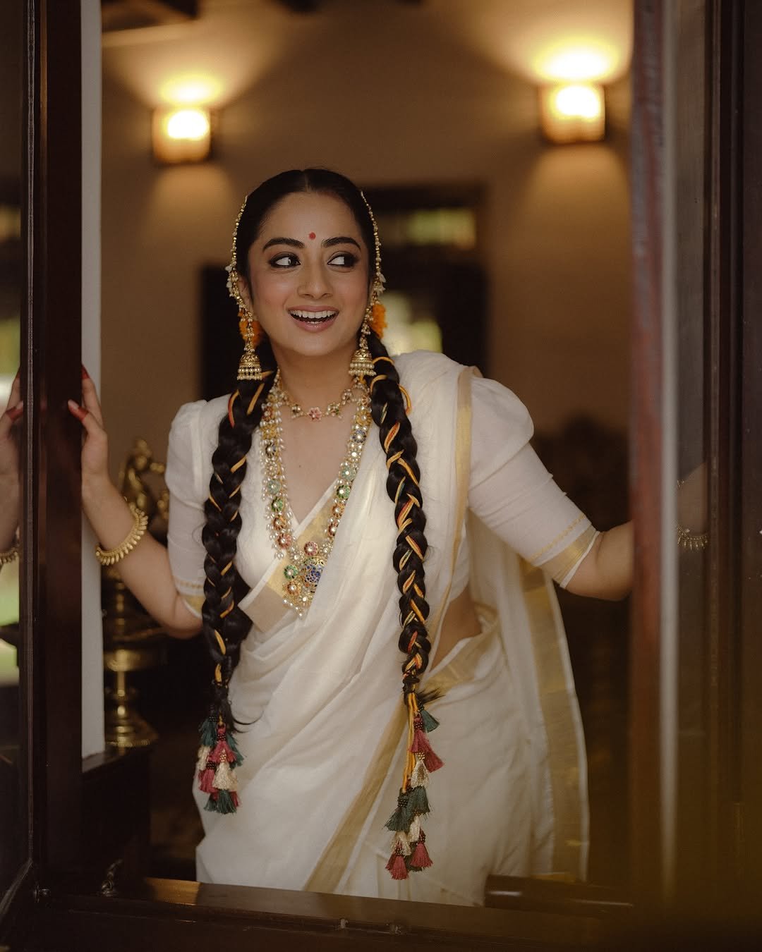 Namitha Pramod traditional braids jasmine gajra golden hour Photoshoot (8)