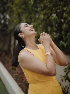 Garden greenery backdrop with Namitha Pramod vibrant yellow outfit