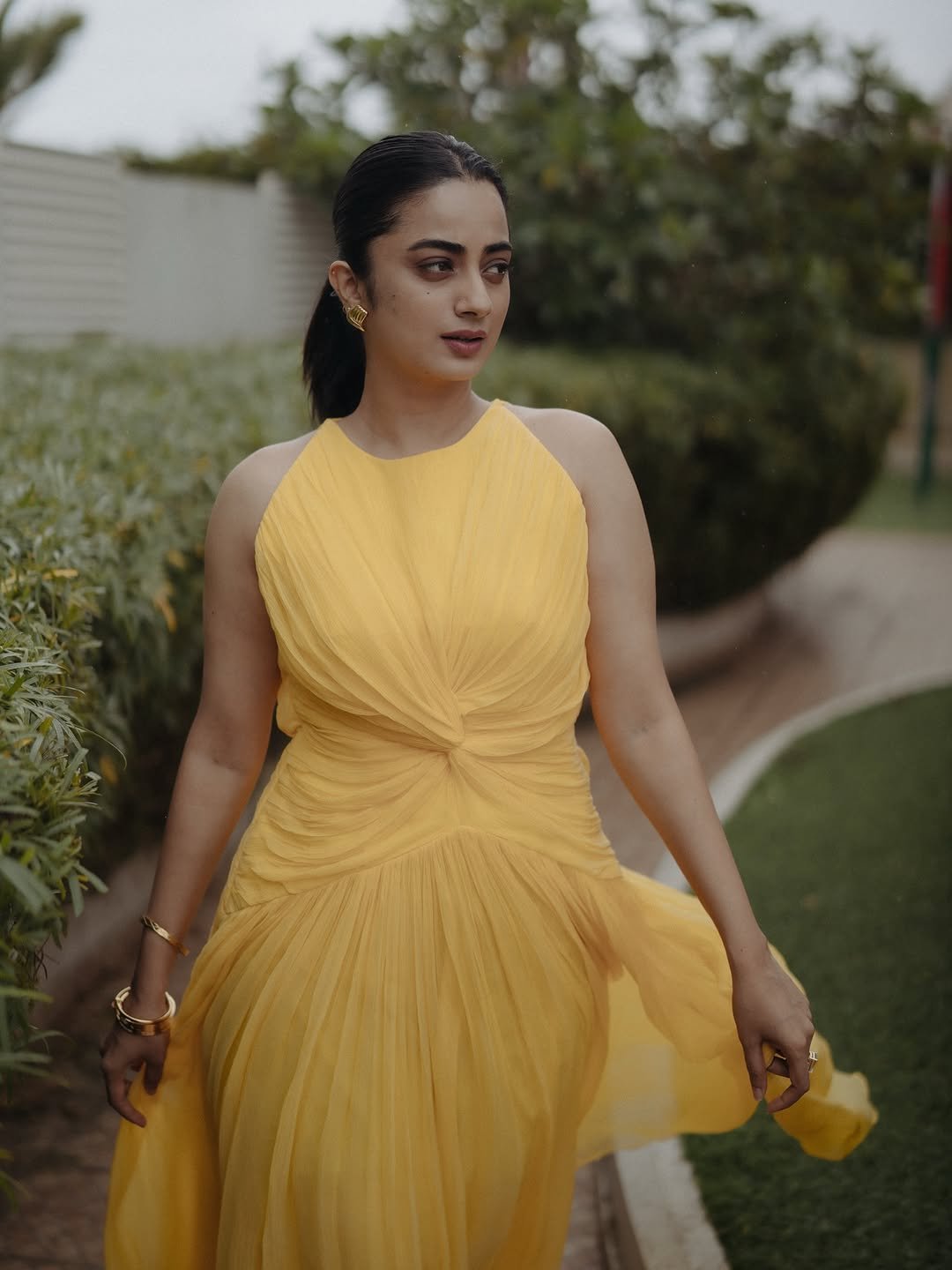 Namitha Pramod yellow twist dress garden gaze Photos (11)