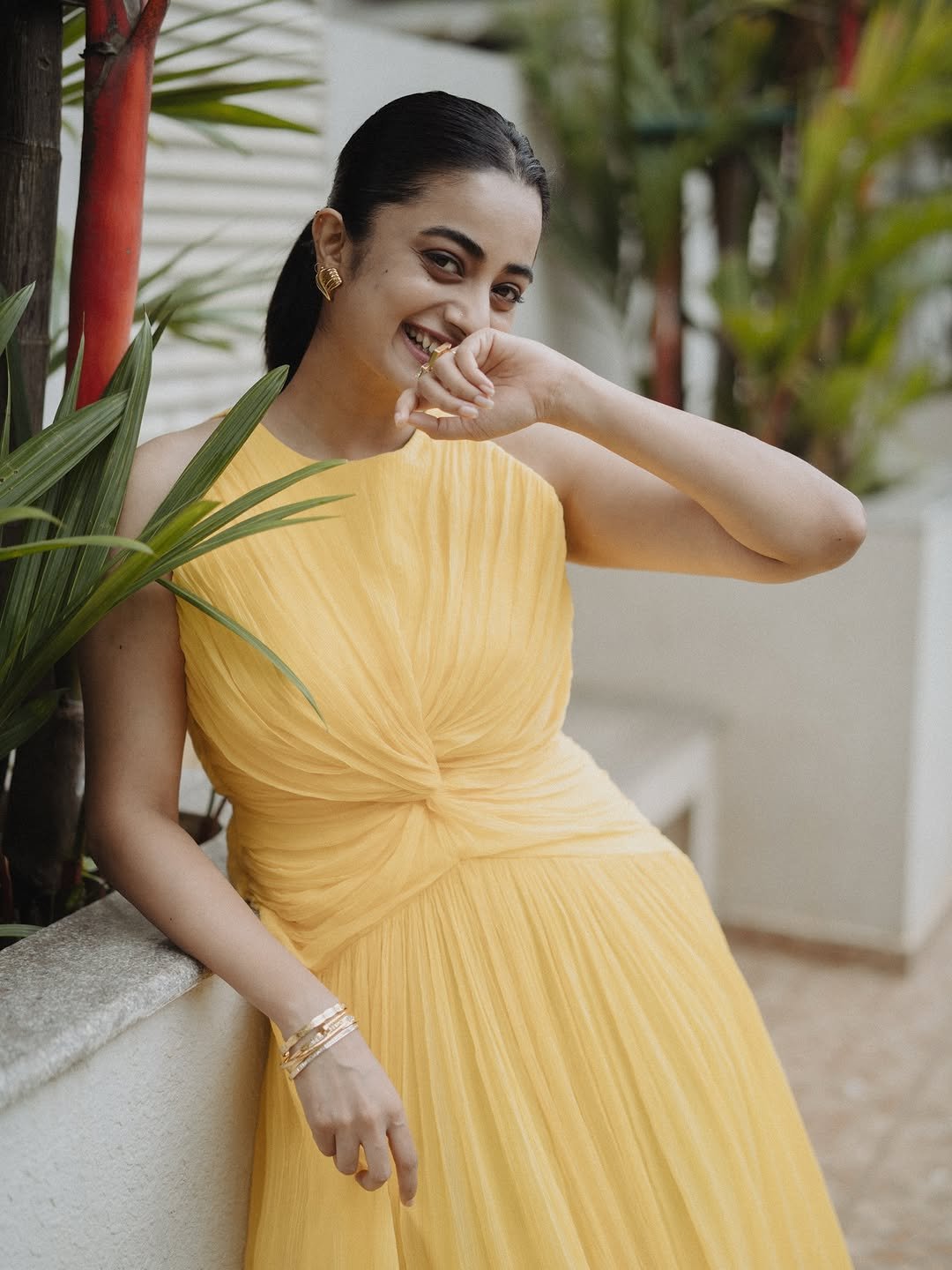 Namitha Pramod yellow twist dress garden gaze Photos (13)