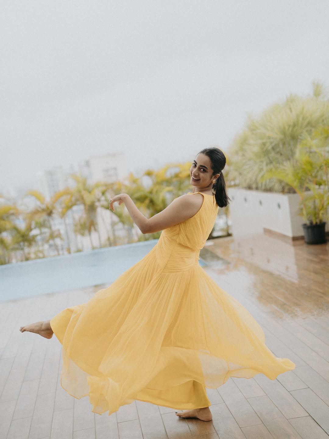 Namitha Pramod yellow twist dress garden gaze Photos (14)