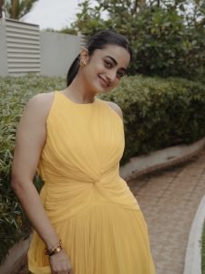 Garden greenery backdrop with Namitha Pramod vibrant yellow outfit