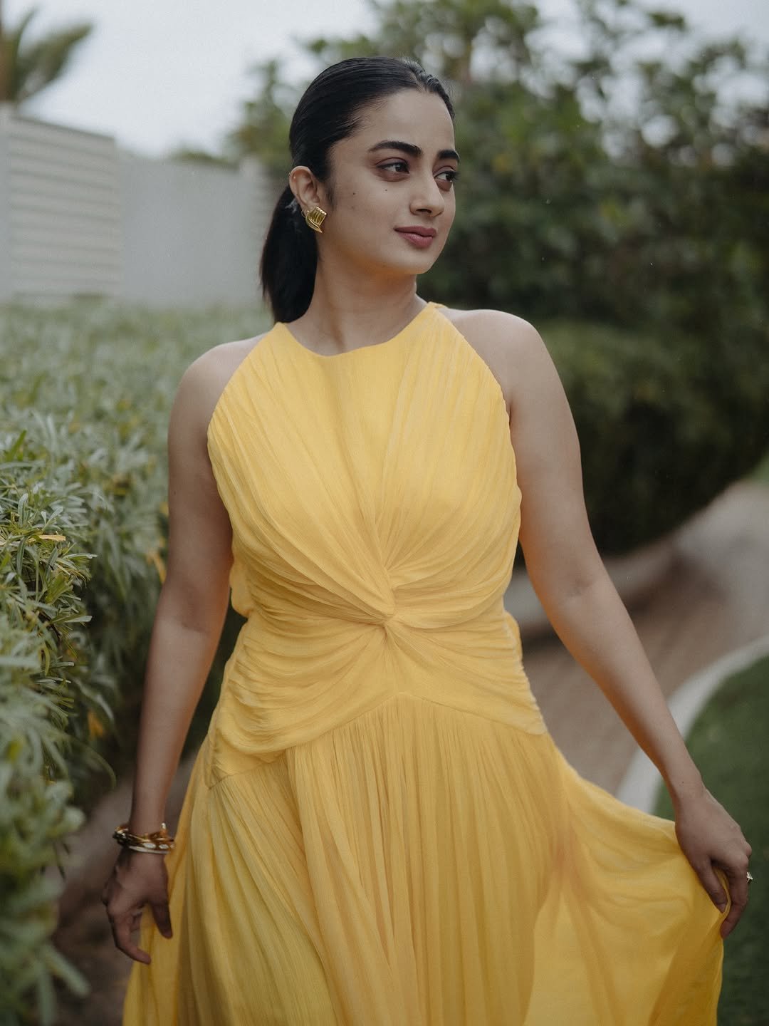 Namitha Pramod yellow twist dress garden gaze Photos (5)