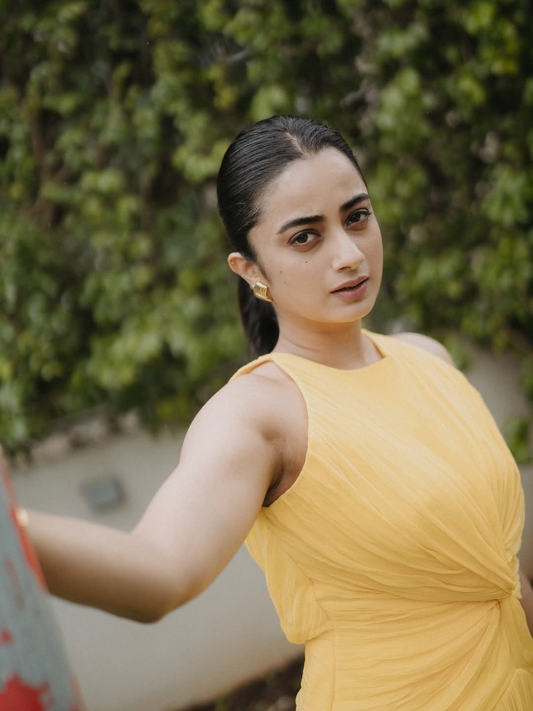 Namitha Pramod yellow twist dress garden gaze Photos (8)