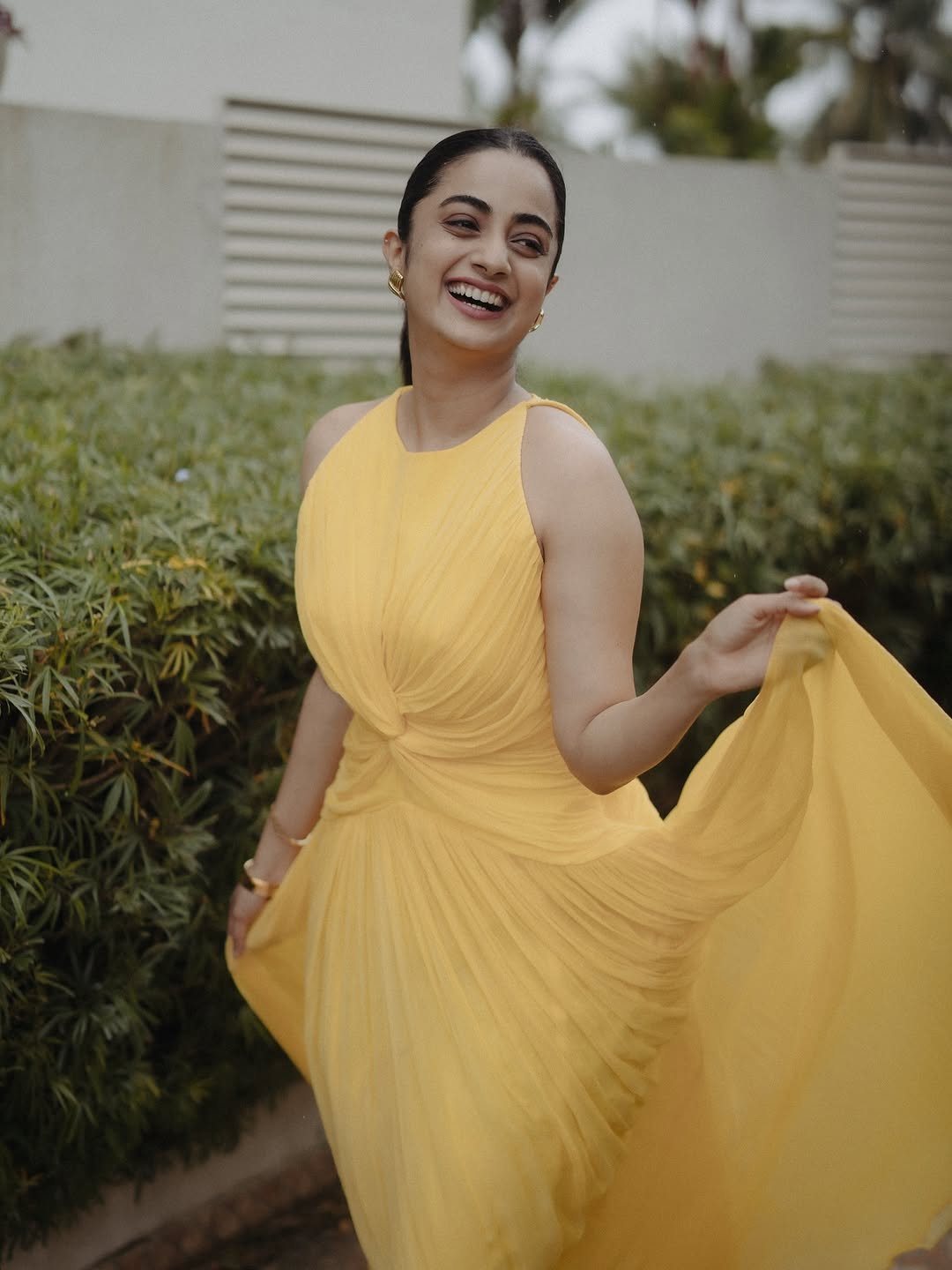Namitha Pramod yellow twist dress garden gaze Photos (9)