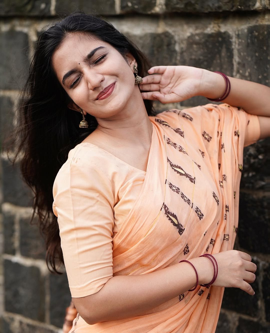 Neha Pathan peach printed saree by calm riverside waters