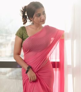 Neha Pathan pink chiffon saree in warm cozy room setting