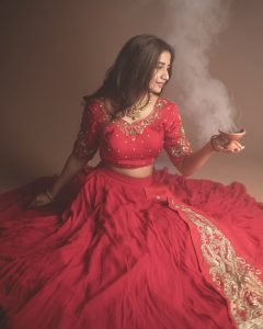 Elegant festive pose from Neha Pathan in vibrant red lehenga