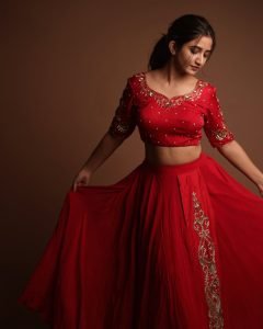 Elegant festive pose from Neha Pathan in vibrant red lehenga