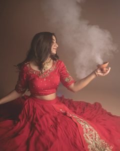Elegant festive pose from Neha Pathan in vibrant red lehenga