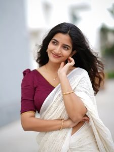 Neha Pathan cheerful expression in textured white saree outfit