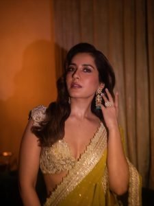 Raashi Khanna olive crystal embellished saree under warm studio lights