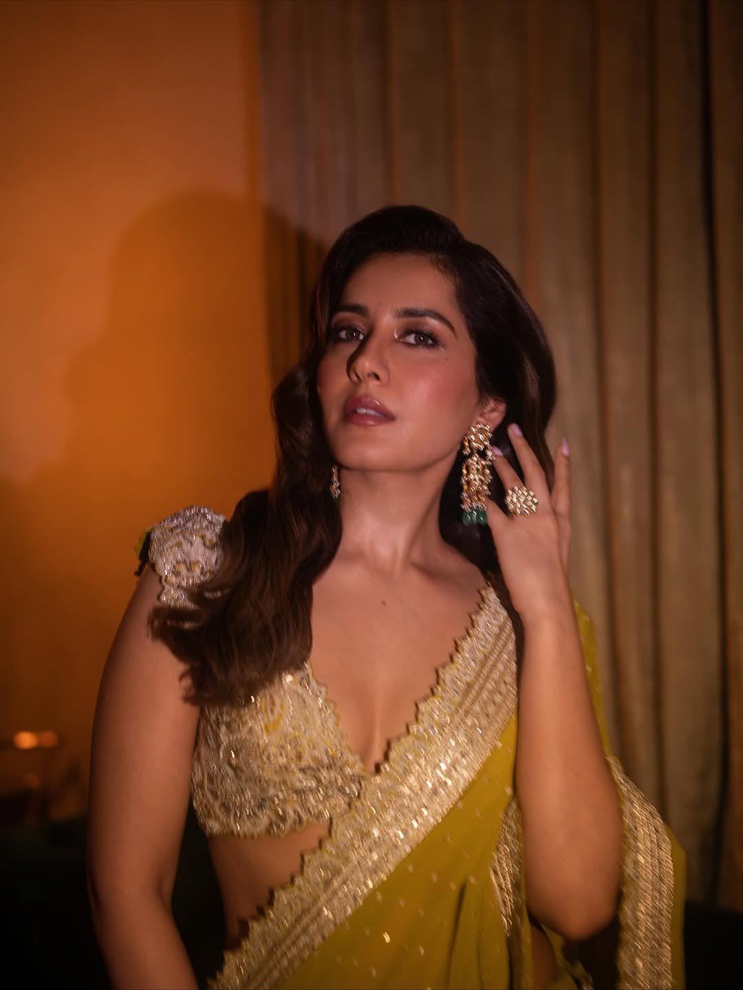 Raashi Khanna olive crystal embellished saree under warm studio lights