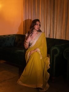 Sparkling crystal details on Raashi Khanna unique olive saree