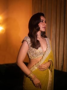 Raashi Khanna olive crystal embellished saree under warm studio lights