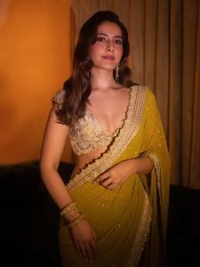 Raashi Khanna olive crystal embellished saree under warm studio lights
