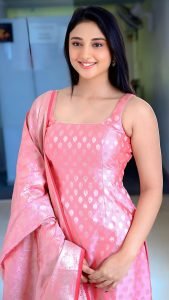 Ritika Nayak joyful expression wearing elegant pink chudidhar