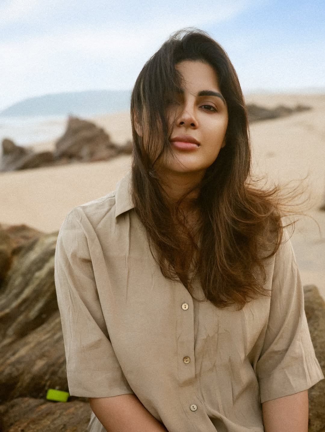 Samyuktha sand-beige shirt beach breeze Portrait (1)