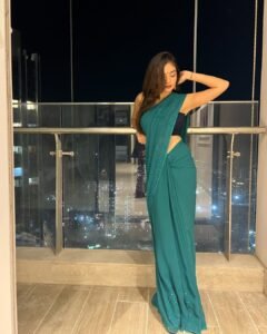 Anushka Sen Glam Teal Saree Night City Balcony Shoot (8)