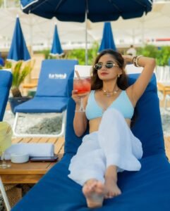 Anushka Sen blue top white pants balcony summer