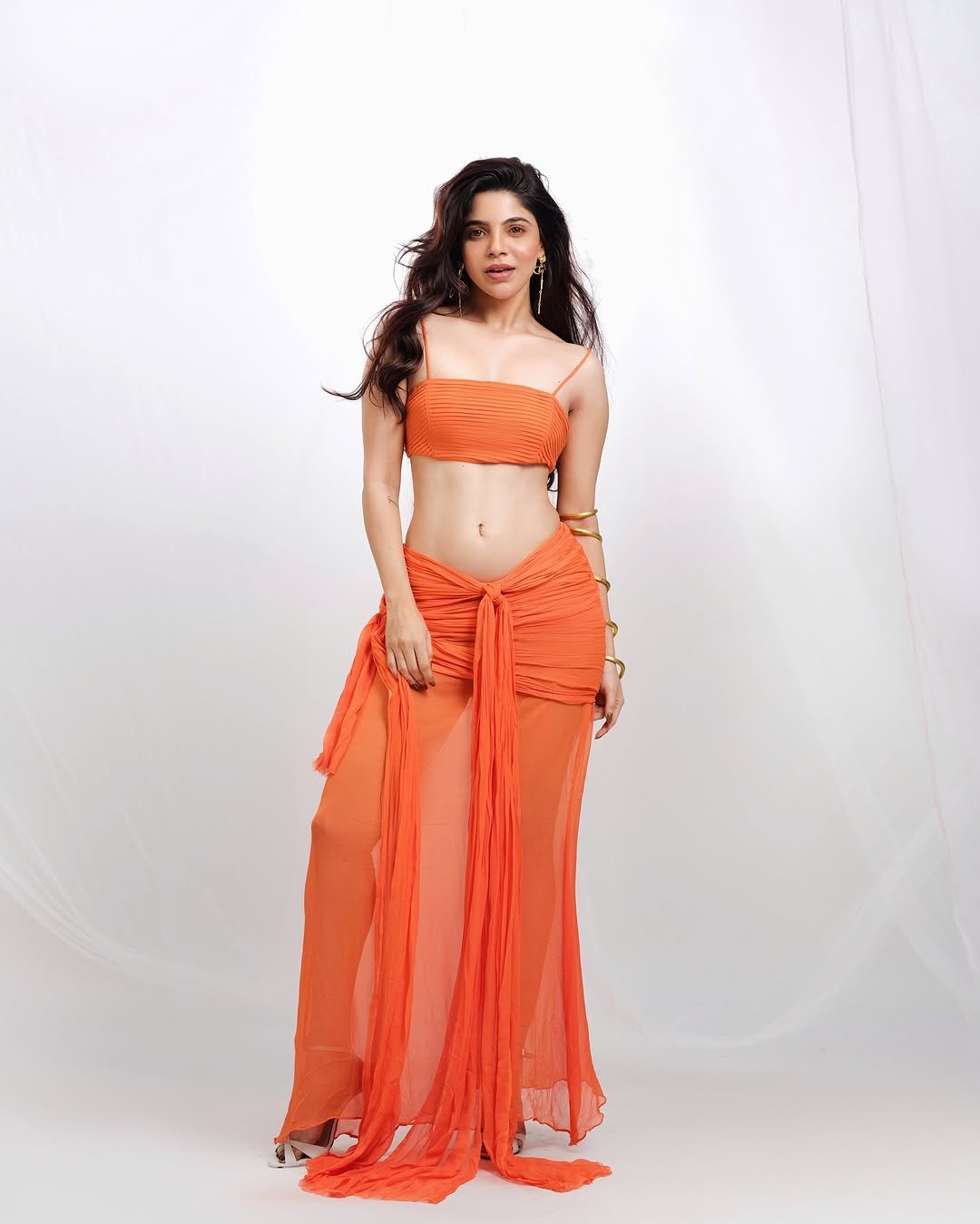 Divya Bharathi Dazzles in Orange Western Crop Top and Skirt Photos (2)