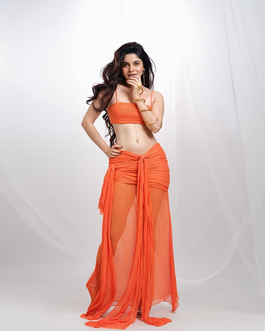 Divya Bharathi Dazzles in Orange Western Crop Top and Skirt Photos (4)