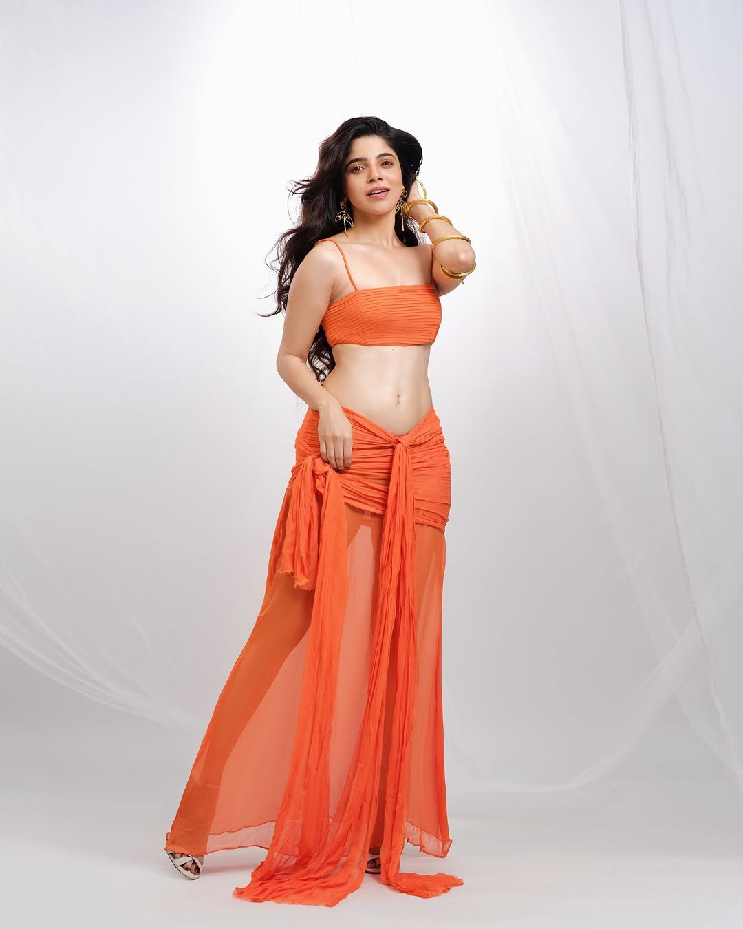 Divya Bharathi Dazzles in Orange Western Crop Top and Skirt Photos (6)